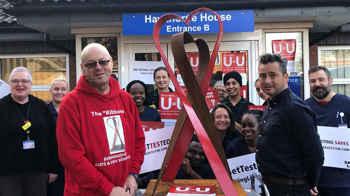 Artist Gary Jones (left) with Dr Steve Taylor and the Heartlands HIV team